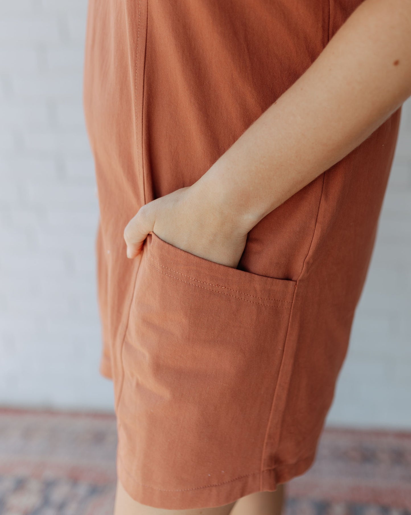 Regan Ruffle Sleeve Romper in Rust
