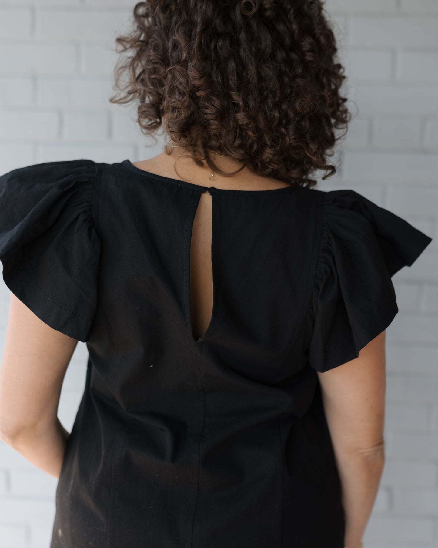 Regan Ruffle Sleeve Romper in Black