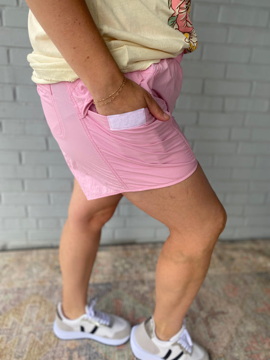 Load image into Gallery viewer, Running the World Pink Shorts
